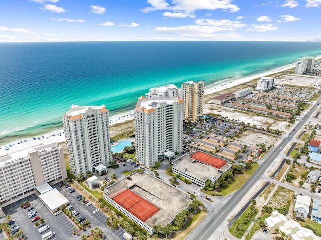 bird's eye view featuring a city view, a view of the beach, and a water view