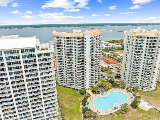 birds eye view of property featuring a water view and a view of city