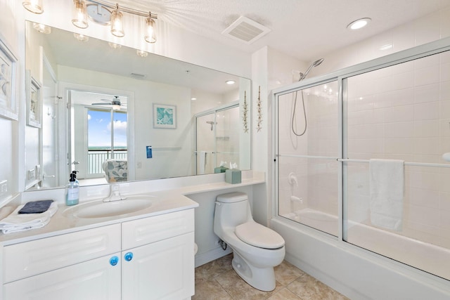 full bath featuring vanity, visible vents, enclosed tub / shower combo, tile patterned floors, and toilet