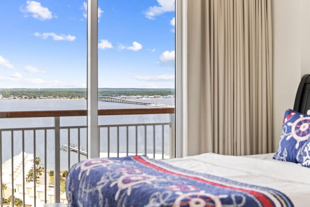 bedroom featuring a water view