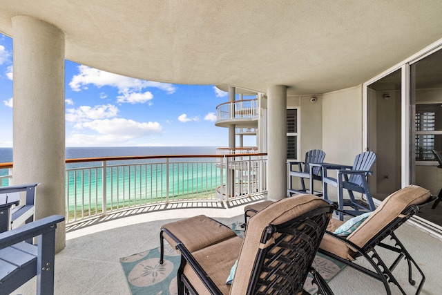 balcony featuring a water view