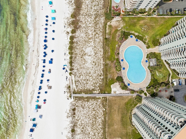 drone / aerial view with a water view and a view of the beach