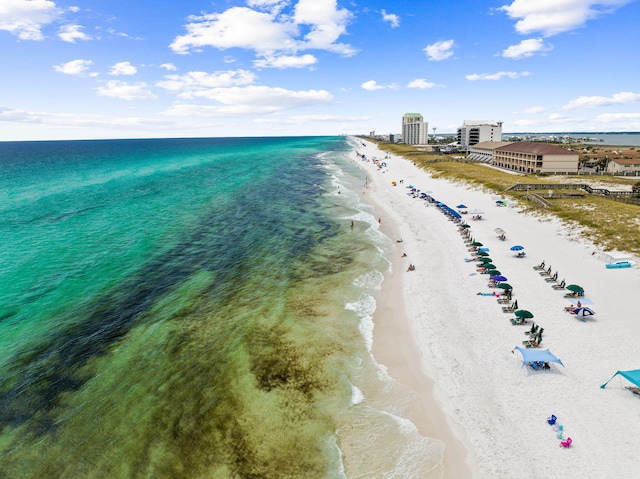 bird's eye view with a water view and a view of the beach