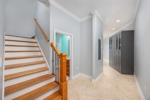 staircase with crown molding and tile patterned flooring