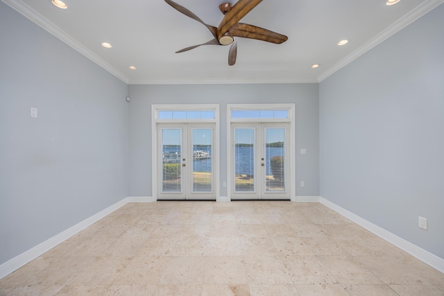 empty room with ceiling fan, ornamental molding, and french doors