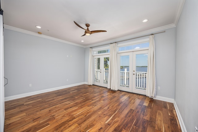 unfurnished room featuring ceiling fan, crown molding, wood-type flooring, and french doors