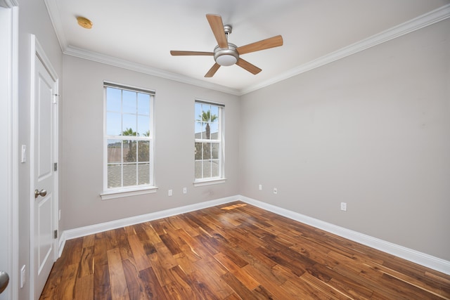 empty room featuring ceiling fan, hardwood / wood-style floors, and ornamental molding