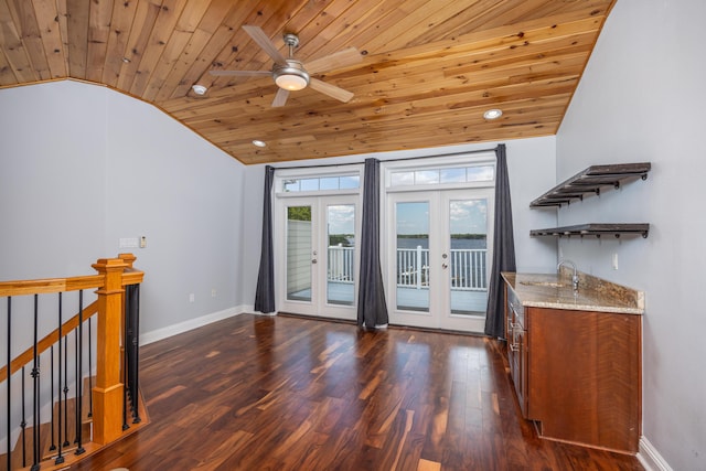 interior space with french doors, dark hardwood / wood-style floors, wood ceiling, vaulted ceiling, and indoor wet bar