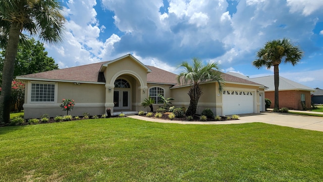 ranch-style home featuring a garage and a front yard