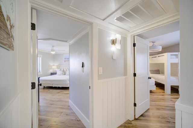 corridor with light hardwood / wood-style flooring