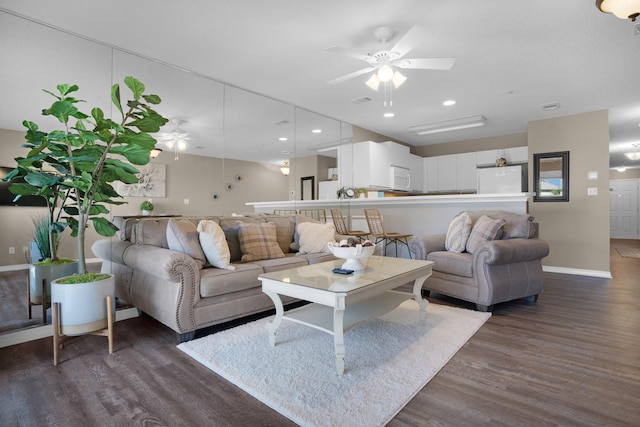 living room with dark wood-style flooring, recessed lighting, a ceiling fan, and baseboards