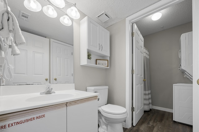 full bathroom with toilet, visible vents, wood finished floors, and vanity