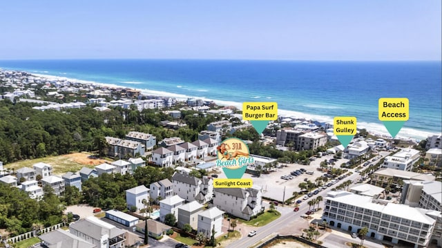 birds eye view of property featuring a water view and a view of the beach