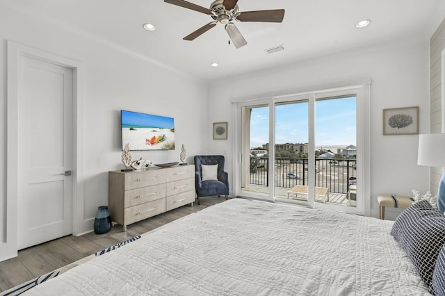 bedroom featuring ceiling fan, access to exterior, and hardwood / wood-style floors