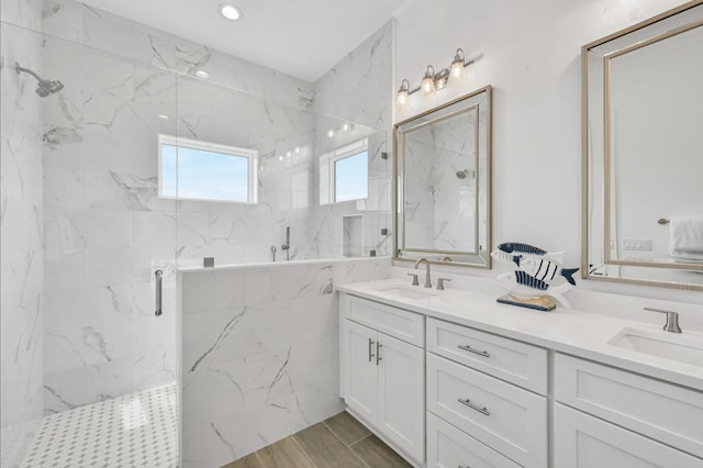 bathroom featuring vanity and a shower with shower door