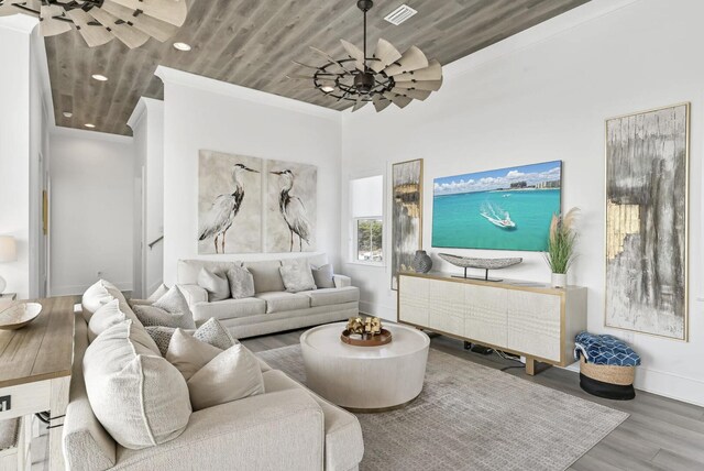 living room with crown molding, ceiling fan, hardwood / wood-style floors, and wooden ceiling