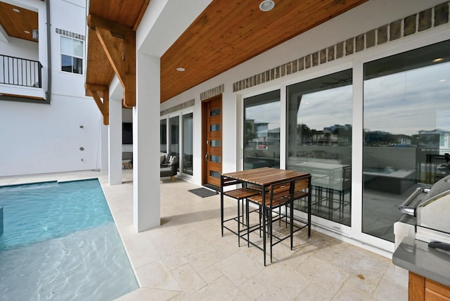 view of swimming pool with a patio area