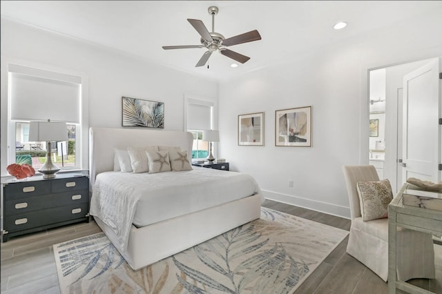 bedroom with hardwood / wood-style floors and ceiling fan