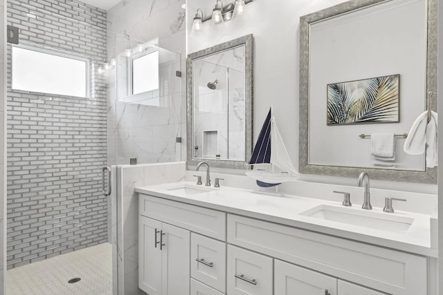 bathroom with walk in shower and vanity