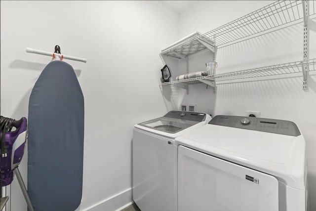 washroom featuring independent washer and dryer