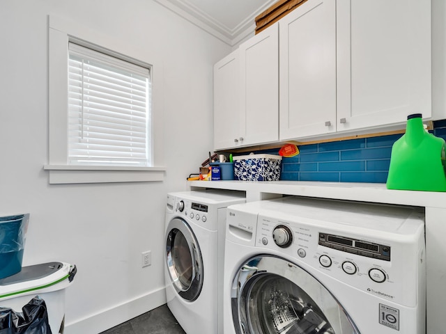 washroom with ornamental molding, cabinets, washing machine and dryer, and tile patterned flooring