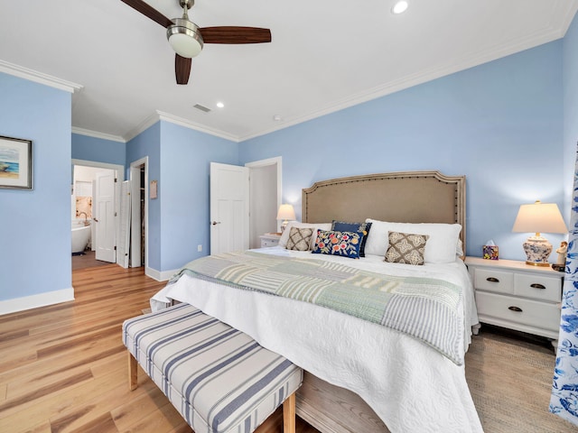 bedroom featuring ornamental molding, ceiling fan, light wood-type flooring, and ensuite bath