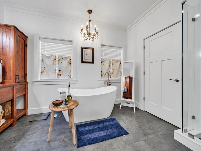 bathroom with a notable chandelier, a bathtub, and ornamental molding