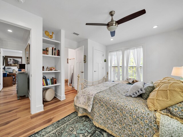 bedroom featuring light hardwood / wood-style flooring and ceiling fan