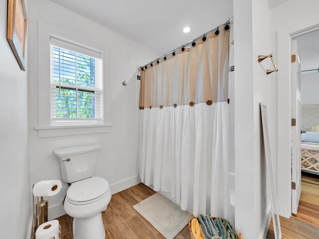 bathroom featuring toilet and hardwood / wood-style floors