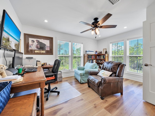 office with ceiling fan and light wood-type flooring