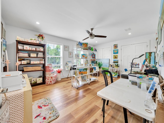 office space with ceiling fan and light wood-type flooring