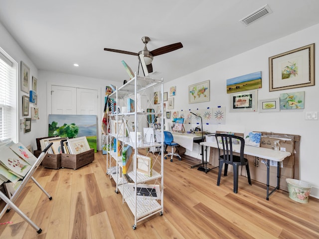 interior space with ceiling fan and light hardwood / wood-style floors