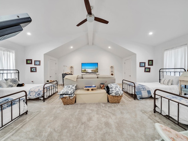 carpeted bedroom featuring multiple windows, vaulted ceiling with beams, and ceiling fan