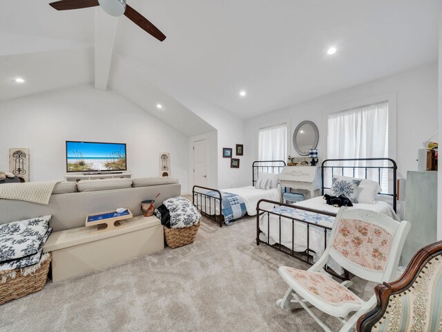 bedroom featuring lofted ceiling with beams, ceiling fan, and light colored carpet