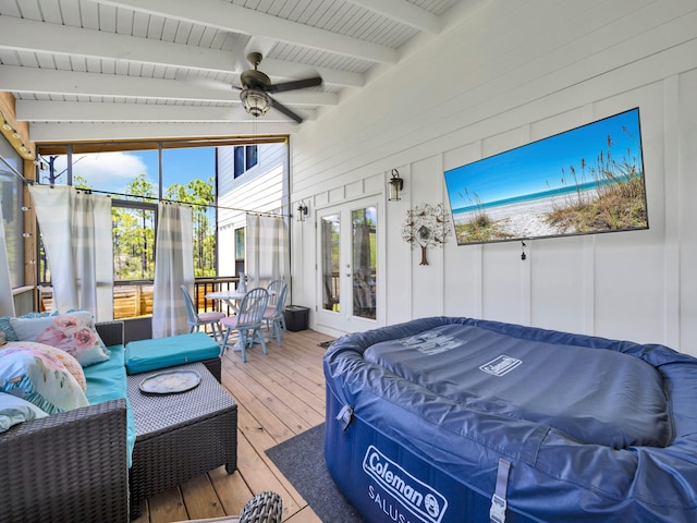 sunroom / solarium with vaulted ceiling with beams, french doors, and ceiling fan