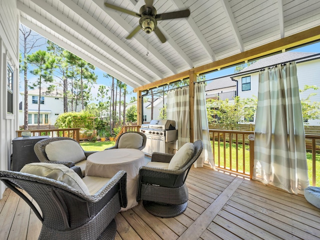 sunroom / solarium with lofted ceiling with beams and ceiling fan