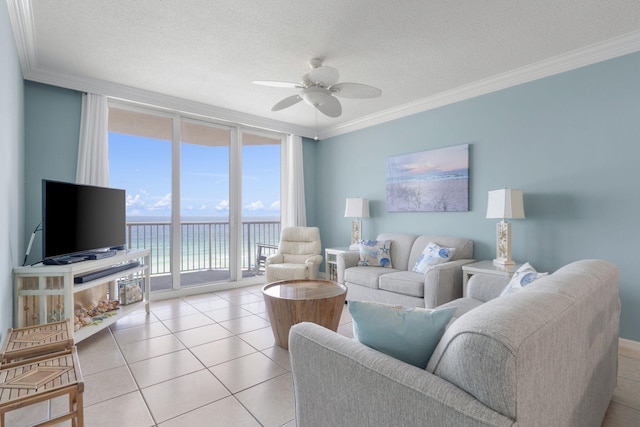 8573 Gulf Blvd Unit 703, Navarre, FL 32566 - living room with floor to ceiling windows, ceiling fan, ornamental molding, light tile patterned flooring, and a textured ceiling