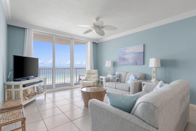8573 Gulf Blvd Unit 703, Navarre, FL 32566 - living area featuring floor to ceiling windows, a ceiling fan, crown molding, light tile patterned floors, and a textured ceiling
