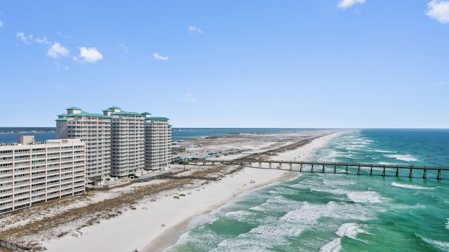 aerial view with a water view and a beach view