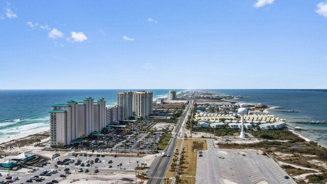 birds eye view of property with a view of the beach and a water view