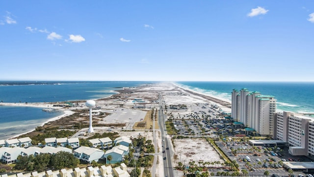 bird's eye view featuring a water view and a view of the beach