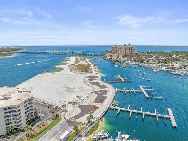 birds eye view of property with a water view and a view of the beach