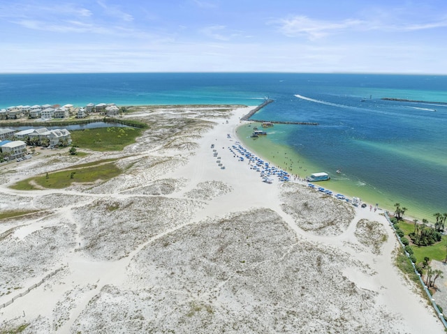 birds eye view of property featuring a water view and a view of the beach