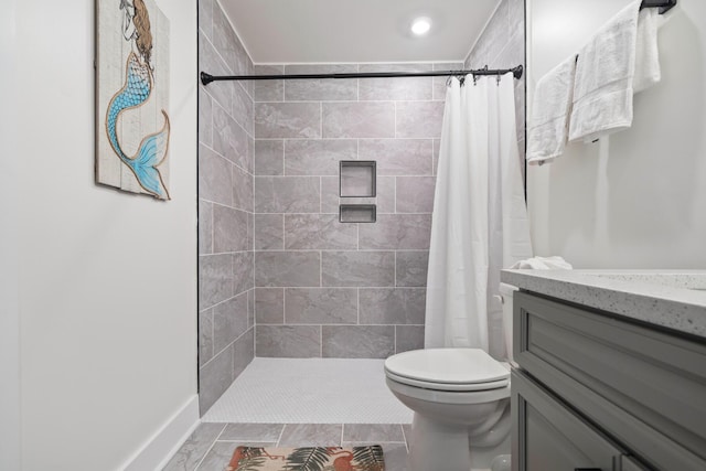 bathroom with vanity, a shower with shower curtain, and toilet