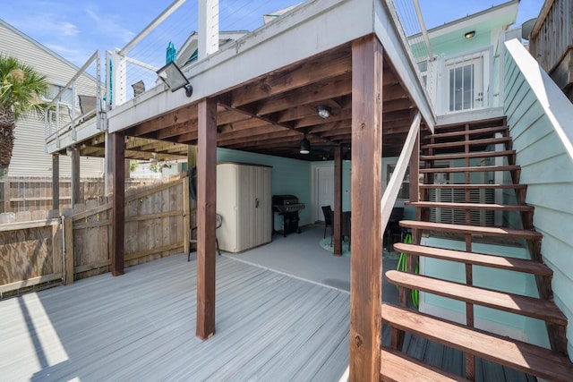 wooden terrace featuring grilling area