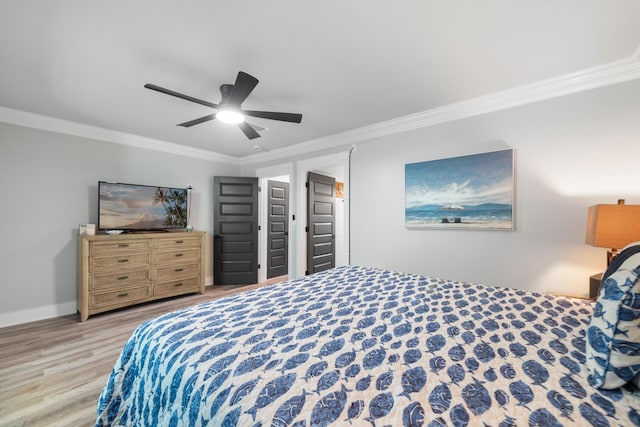 bedroom featuring ceiling fan, ornamental molding, and light hardwood / wood-style flooring