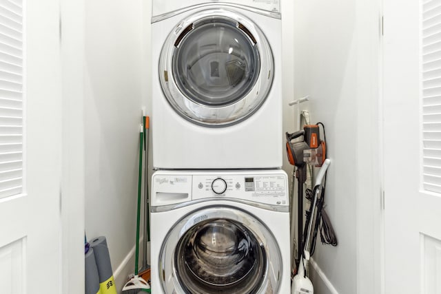 laundry area with stacked washer / drying machine