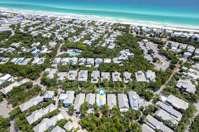 bird's eye view featuring a water view and a beach view