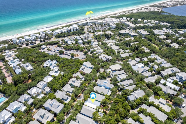 drone / aerial view with a water view and a beach view