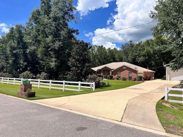 single story home with a front yard